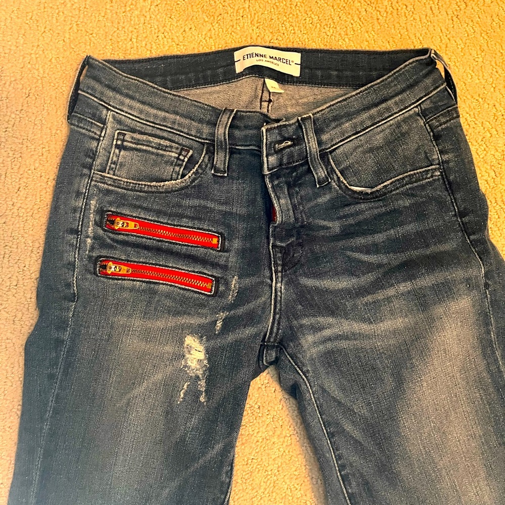 Best blue, with red zipper accent, skinny jeans.